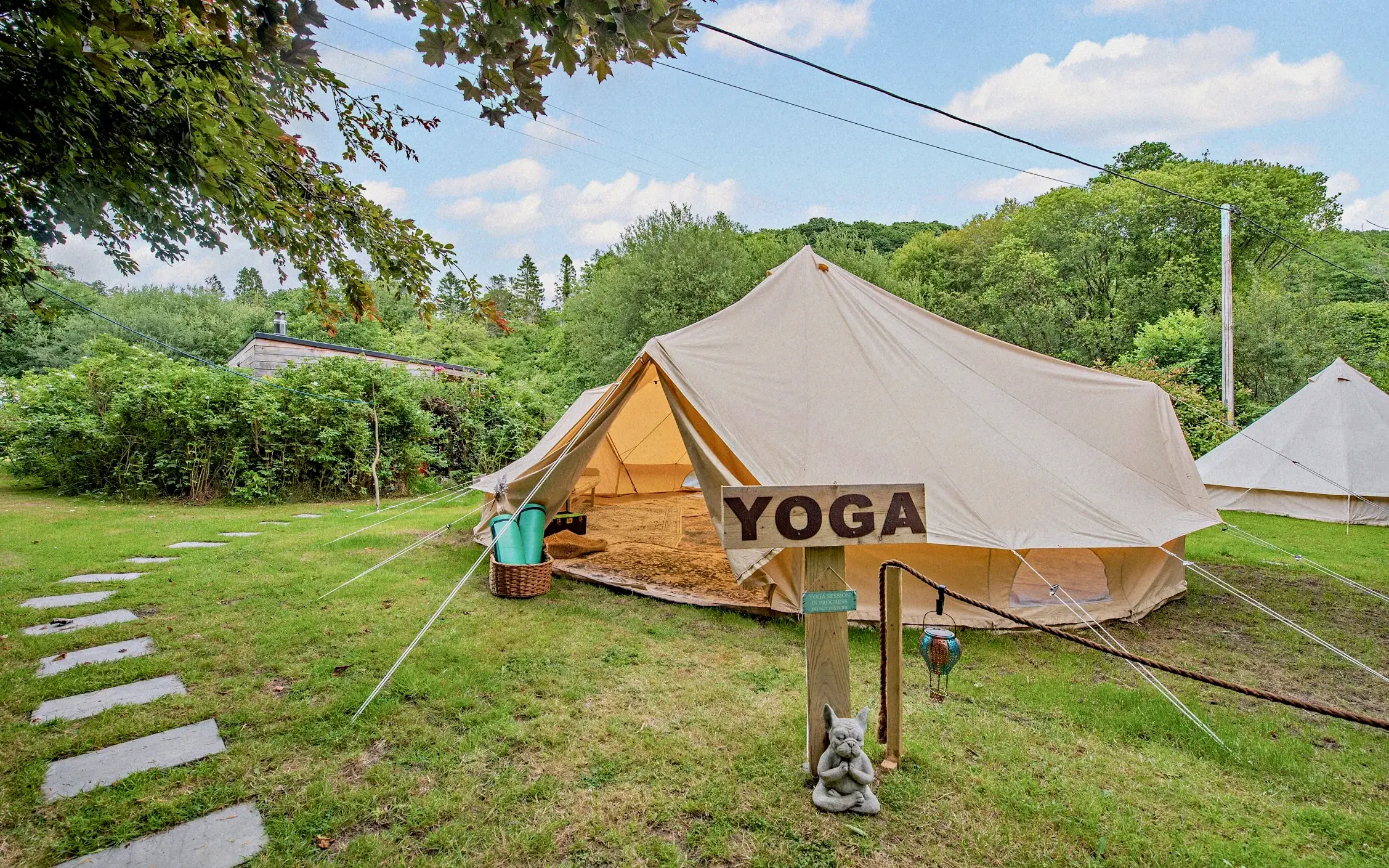 Velindre House-peach-toned country home with ivy, outdoor seating, and soft evening light.